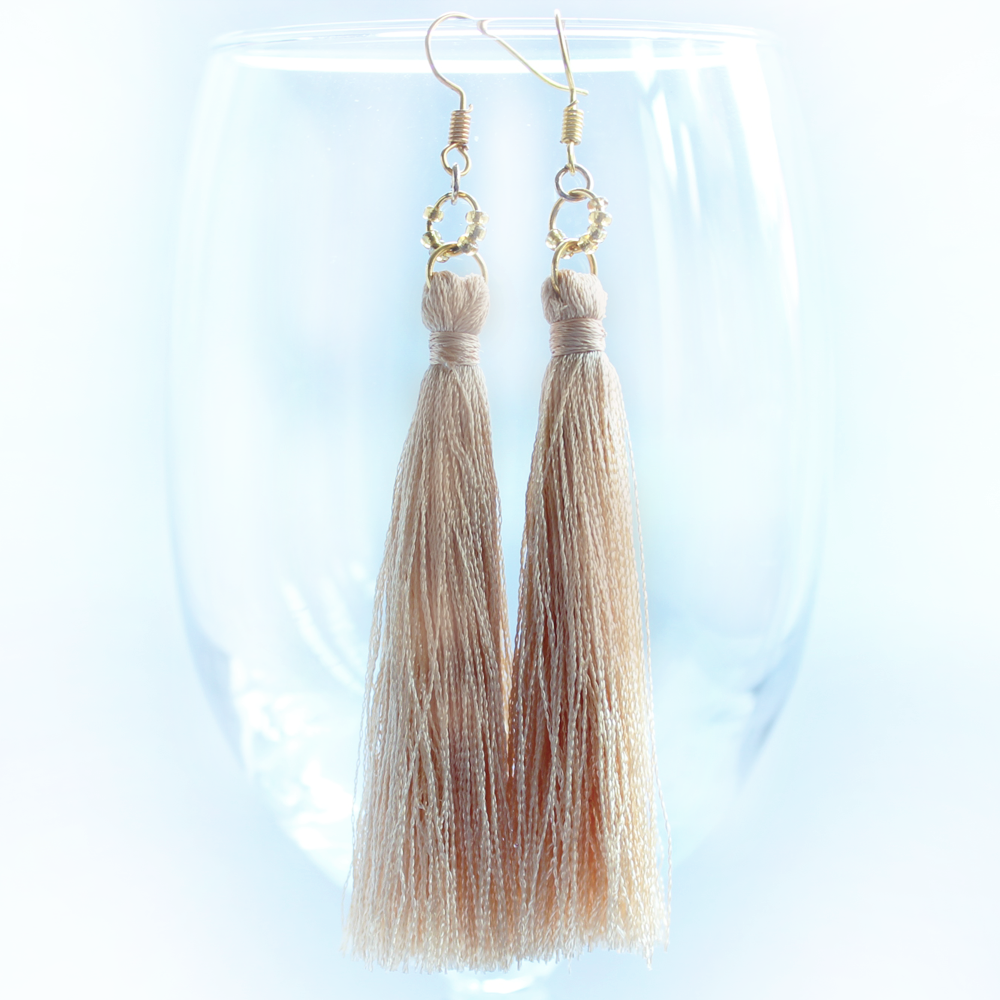 gold glow tassel earrings