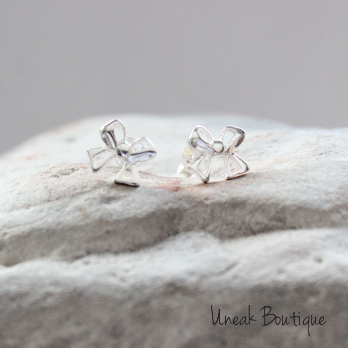 Silver bow sales stud earrings